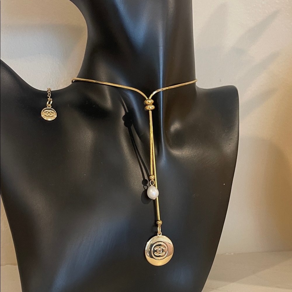 Elegant Chanel Gold Pendant Necklace with Pearl Accent
